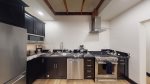 Full size kitchen with great lighting and cabinets for storage